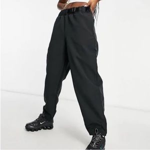 Women's Nike Sportswear Tech Pack Pants Black
(MSRP $100)